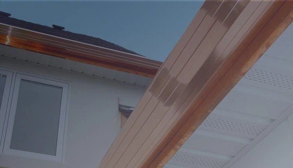 Copper rain gutter on a custom Reno home